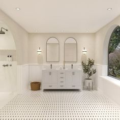 a large bathroom with two sinks and three mirrors on the wall, along with an arched window