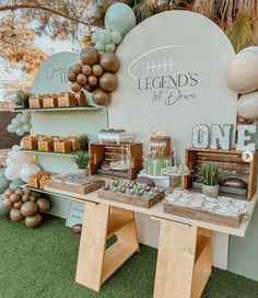 a table topped with lots of desserts next to a sign that says legend's