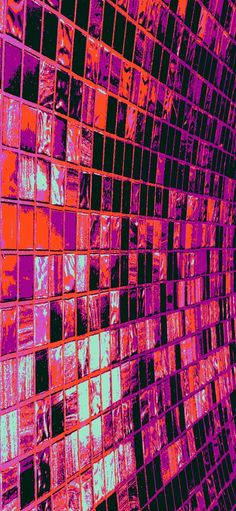 an abstract image of many square tiles in pink and purple colors on a black background