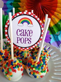 cake pops with rainbow sprinkles on a plate