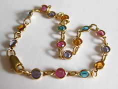 "This is a lovely and dainty gold tone bracelet with multi colored stones.  7\" long in very good vintage condition. FREE SHIPPING IN THE USA ONLY." Bday Jewelry, Vintage Gold Bracelet, Rose Gold Accessories, Dope Jewelry Accessories, Weird Jewelry, Multicolor Jewelry, Handmade Jewelry Tutorials, Dope Jewelry, Colored Stones