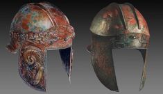 two helmets with elaborate designs on them, one in red and the other in green