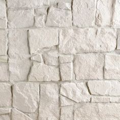 a white brick wall that has been made out of stone