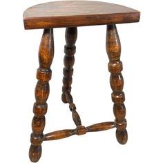 an old wooden stool with turned legs