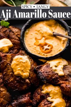 grilled steaks with sauce and garnishes on a black platter