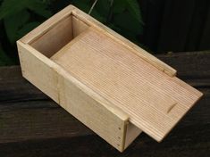 a small wooden box sitting on top of a table