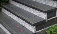 the steps are made of granite and have flowers on them