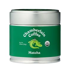 a canister of matcha coffee with a green lizard on the front and white background