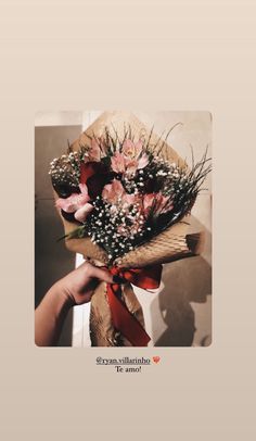 a person holding a bouquet of flowers in their hand with the caption, i love you