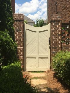 an entrance to a brick building with a wooden door