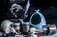 an assortment of coffee beans and spices on a table