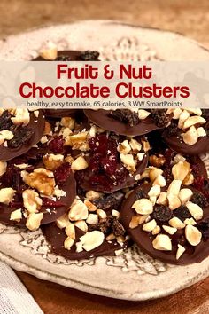 fruit and nut chocolate clusters on a plate with text overlay that reads, fruit & nut chocolate clusters healthy, easy to make, glucious