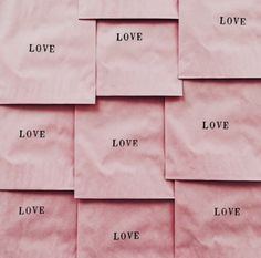 several pieces of pink paper with words on them that say love, happiness, and travel