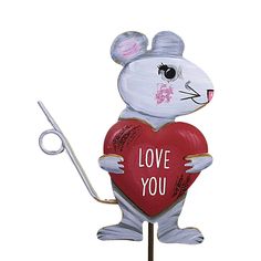 Set Of Two Love Mice. One Stake Measures 29.5 Inches Tall Is A Gray Mouse Holding A Red Heart Over His Head With "Love You More" Written In The Middle. The Second Stake Is 25.5 Inches Tall With A Gray Mouse Holding A Red Heart In His Hands With "Love You" Written In The Middle. To Extend The Life Of Your Purchase Apply A Clear Matte Protective Coating At The Start Of Each Season, Before Exposing The Product To Outdoor Elements. We Recommend Using Uv-Resistant Acrylic Coating, Which Can Be Found At Your Local Craft Store Or Home Improvement Store.. 29.5 In H X 6 In W X 0.5 In D. Purchase includes Two Garden Stakes. Decorative Garden Stakes, Second Love, Kids Story Books, Local Crafts, Craft Store, Garden Stakes, Good Morning Wishes, Valentine Decorations, Garden Patio