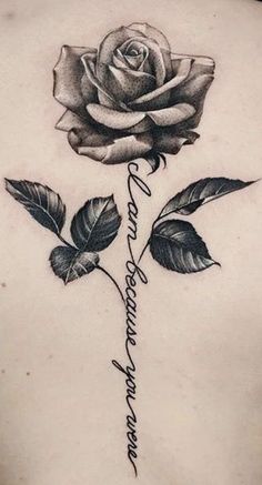 a woman's back with a rose and the words i love you in cursive