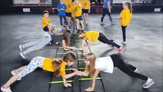 several children are doing exercises on the floor