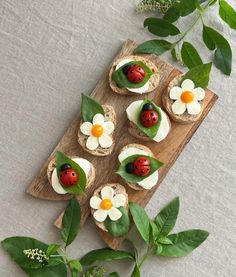 small sandwiches with ladybugs and flowers on them