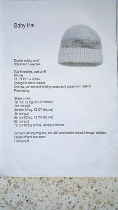 the instructions for baby hat are displayed in front of a white paper with black writing on it