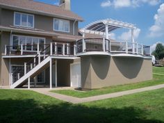 an apartment building with balconies on the second floor