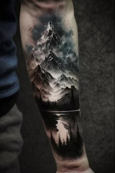 a man's arm with a mountain and lake tattoo on the left inner forearm