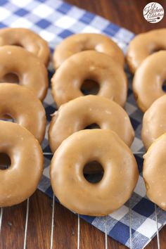 there are many glazed doughnuts on the cooling rack with words pumpkin french yogurt donuts