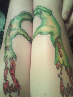 two people with tattoos on their legs holding each other's butts and hands