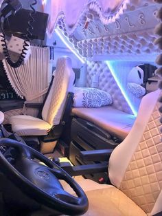 the interior of a vehicle with white and black decor