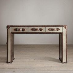 an antique console table with four drawers and knobs on the top, in front of a white wall