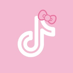 a pink and white logo with a bow on it's head, in the shape of a letter j