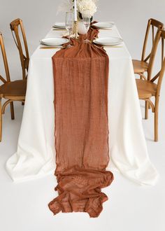 We're so happy to introduce our new fall table runners! It's a gorgeous, handmade cheesecloth table runner that adds boho style to your wedding. What's more, it's the perfect table decor for your terracotta wedding, fall baby shower or wedding arch--and it's super easy to use. Just lay it out on top of your table, and you're all set! You can even add some greenery in between the layers for an extra pop of color. ♥ Place it in the center of the table, don't forget to make relaxed fabric waves, put some candles and flowers on it and enjoy a beautiful rustic style. ♥ You can use cheesecloth as a table runner, tieback for chair or wedding arch decoration. Also, it can be used as a scarf or baby shower decoration. Endings of our cheesecloth are raw (rustic unfinished). ♥ My cheesecloth is 100% Brown Table Decor, Terracotta Table Runner, Boho Wedding Table Decor, Brown Table Runner, Boho Wedding Table, Terracotta Table, Sweetheart Table Decor, Round Table Decor, Rustic Thanksgiving