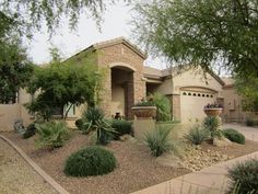 a home with landscaping in the front yard