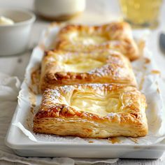 three pastries sitting on top of a white tray