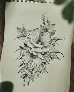 a drawing of some flowers on a piece of paper