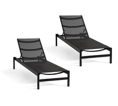 two lounge chairs sitting next to each other