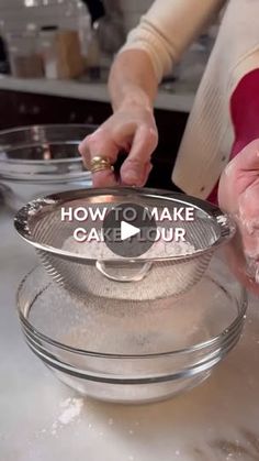 a person is making cake in a glass bowl on a counter top with the words how to make cake flour