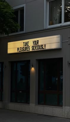 there is a sign that says take your pleases seriously on the side of a building