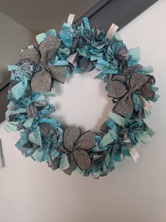 a blue and silver wreath hanging on the wall