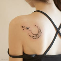 a woman with a tattoo on her shoulder