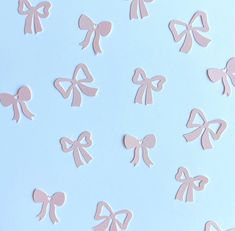 pink bows are arranged on a light blue background