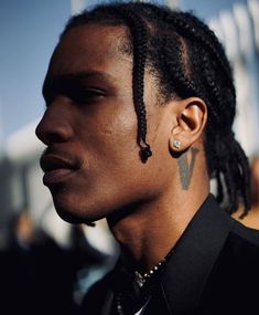 a close up of a person with dreadlocks