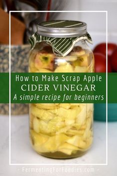 an apple cider vinegar jar filled with sliced apples