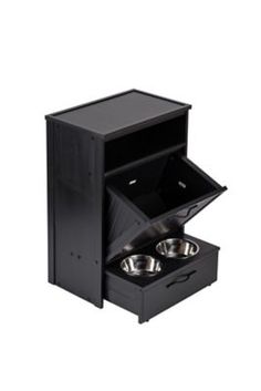 an open black cabinet with two bowls in the bottom section and one drawer on the side