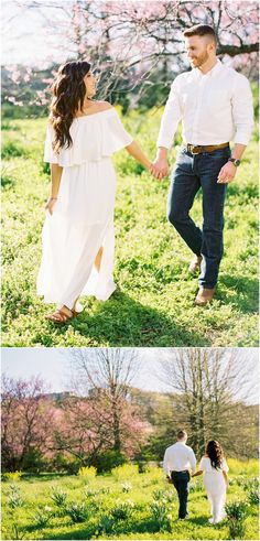 a couple holding hands and walking through the grass