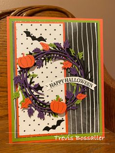 a handmade halloween card with pumpkins and bats