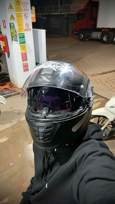 a person wearing a motorcycle helmet and goggles