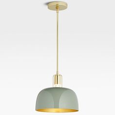 a green and gold pendant light hanging from a ceiling