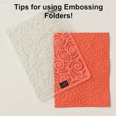 two orange and white folders with the words tips for using embossing folders