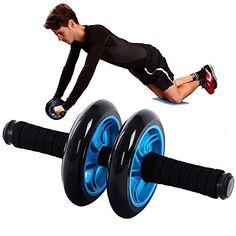 a man is doing push ups on two exercise wheels