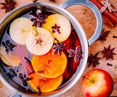 an apple cider with cinnamon, star anise, and orange slices in it