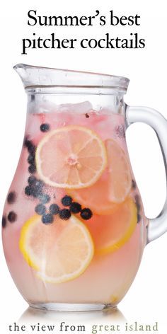 a pitcher filled with liquid and lemon slices